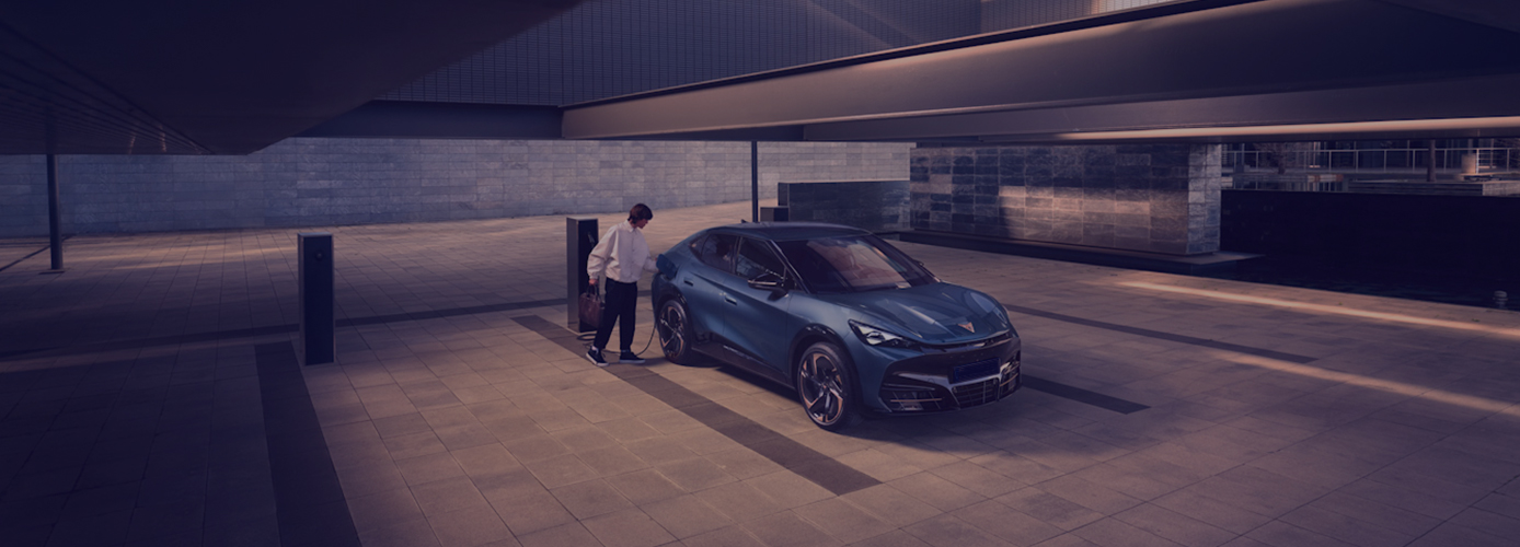 A man charging his EV - Contact Remserv for EV novated lease incentive.